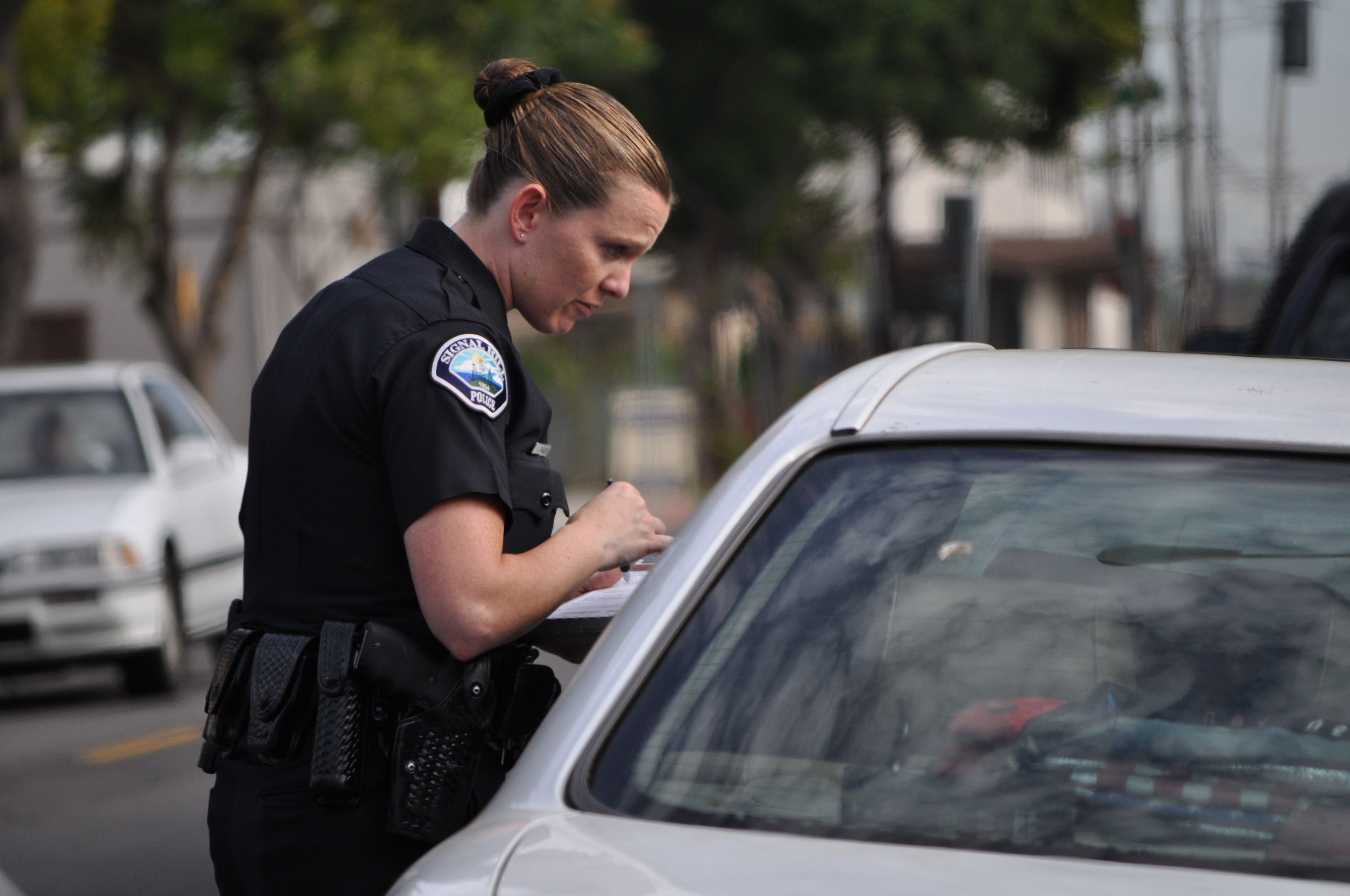 Officer talking to the driver of a car