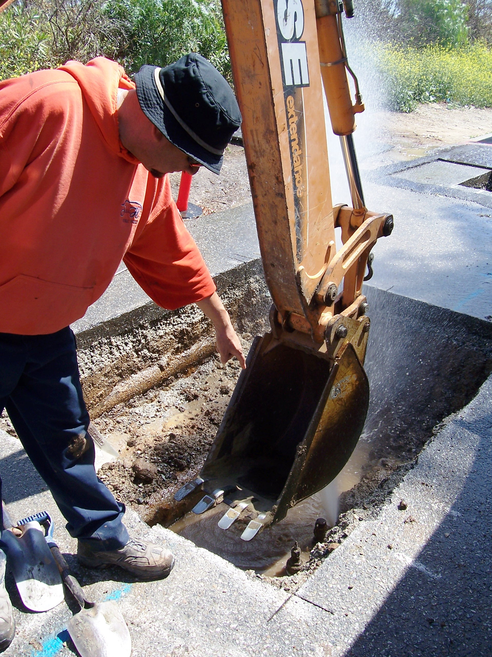 Using heavy machinery to dig a hole